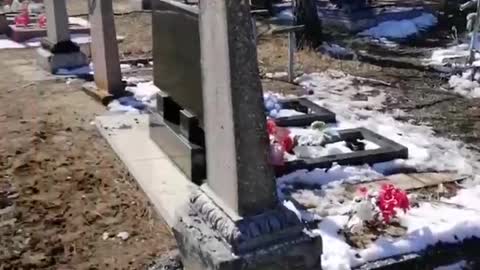 Ukrainian dug in right in the cemetery. And mocking at the graves