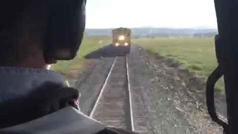 Train Barely Passes Beneath Helicopter