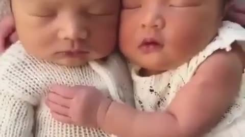 cute child sleeping with his brother