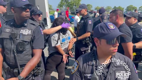 Police arrest a woman wearing a ‘Back the Blue’ shirt