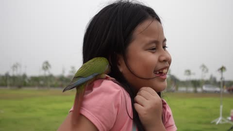 A girl with a parrot!