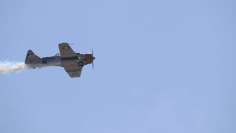 3 North American Aviation T-6 Texans performing a flyby