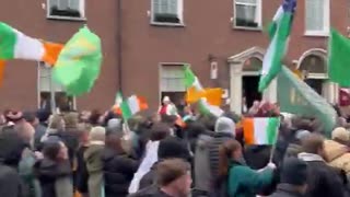 People protesting on the streets of Dublin, Ireland against the influx of immigrants.