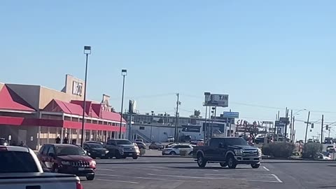 head fake on a white passenger van enters the shopping center