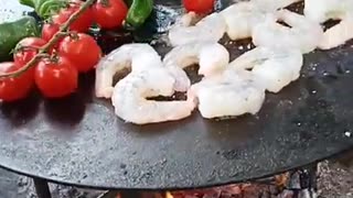 Delicious vegetables and shrimps on the campfire. Do you also like to cook outside?