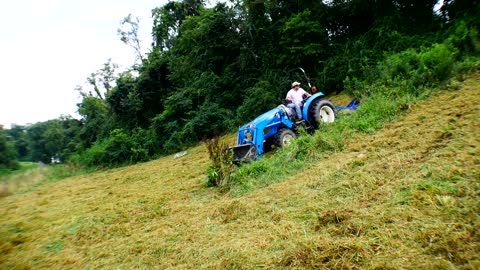 LS Tractor Brush Hogging Steep Hills