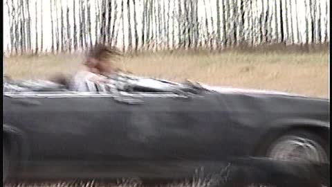 rain driving old car in field movie