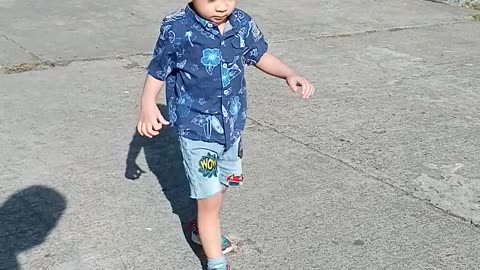 Baby walking in the sun