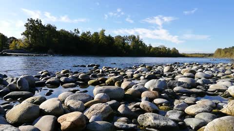 LANDSCAPES-river 4K - Piles Of Rocks Along The River