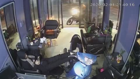 Scooter Crashes into Shop