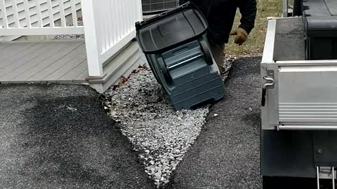 Determined Man Goes To War With Garbage Can During Wind Storm