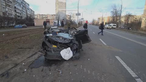 Russian tank running over a civil car in Kiev, Ukraine