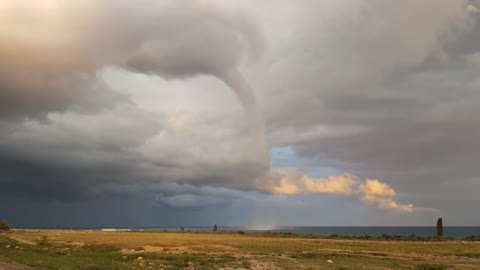 Massive waterspout over lake resembles tornado