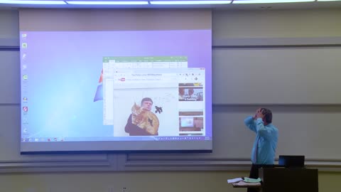 professor trying to solve Math Professor Fixes Projector Screen April Fools Prank