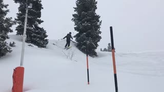 Two angles skier bellyflop on snow