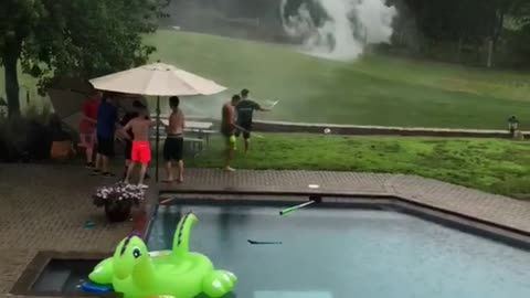 Fireworks in backyard next to pool