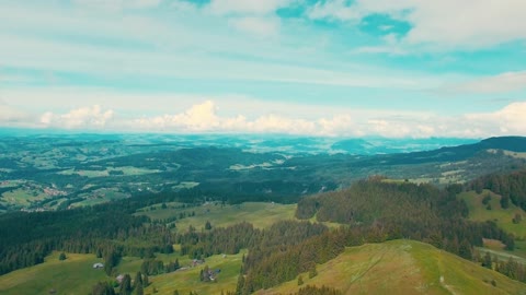 Beautiful Forest along with the green land and beautiful village in the middle if mountains