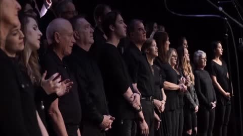 Chris playing with the choir worship