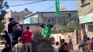 Palestinians celebrate near purported Israeli tank
