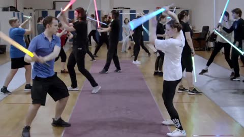 Young Jedi on lightsaber training - School of Saberfighting