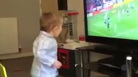 Most adorabele wee soccer fan celebrates a goal by the Glasgow Rangers