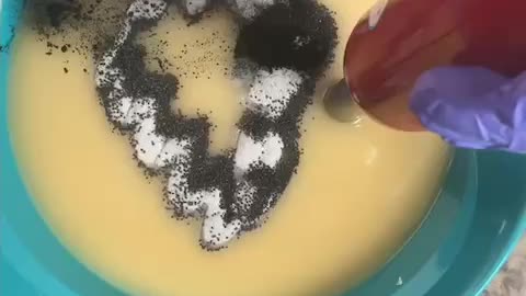 Mixing colorant into soap batter