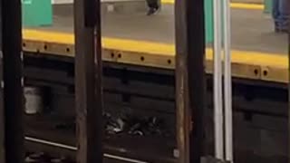Man dances by himself across subway station