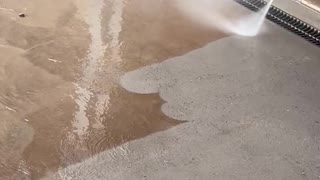 Cleaning a sandy driveway