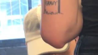 Person tattoo arm tombstone gravy