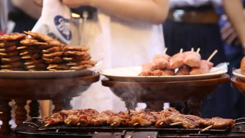 Chicken skewers being roasted