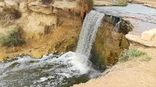 Tourist Enjoys Day Tour Visit To Old Waterfalls Of Wadi El Rayan Egypt