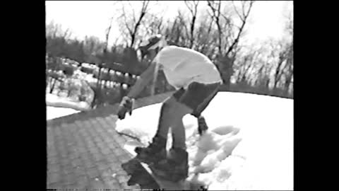 Kid On Snowboard Falls Off Of Roof