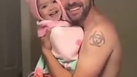 Baby girl singing a song with her dad together