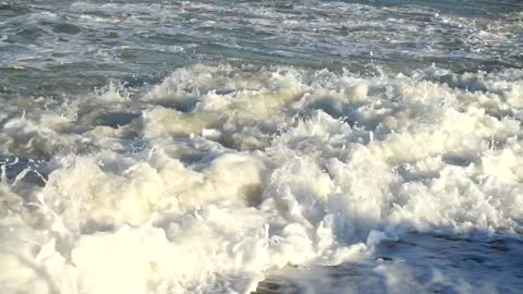 Closeup of breaking waves in slow motion