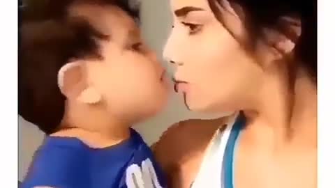 Cute baby kissing his mother.