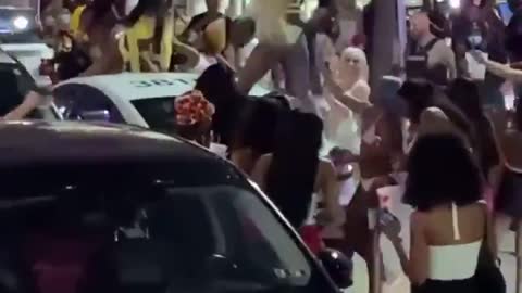 Spring Breakers twerk on police car, Miami Beach police use pepper spray to break up crowds