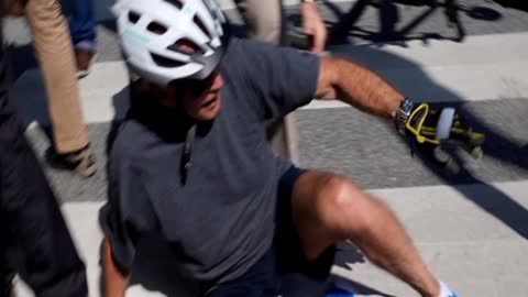 Joe Biden falls off the bike !!