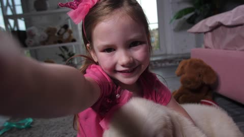 Young girl and her dog smiling at the camera