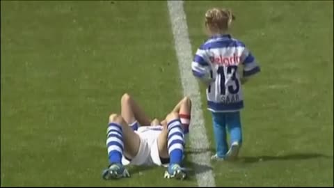 child comforting soccer player who was crying after missing the penalty