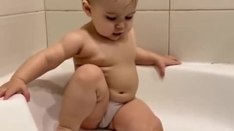 Cute chubby baby try to take a bath - Funny video