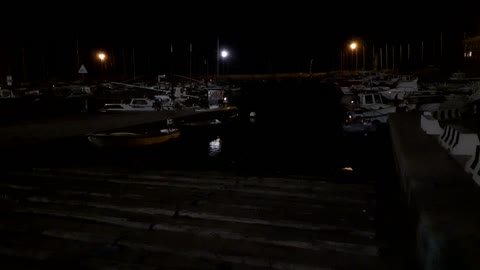 Night lights on the seaport - View from the wooden platform