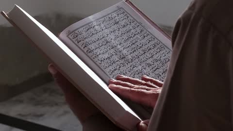 Man Reading Quran