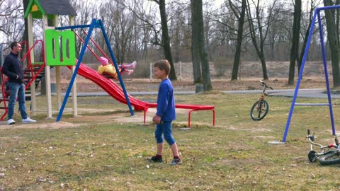 Little attractive boy play in the park \ Play football ⚽