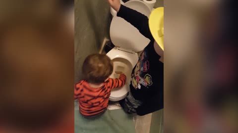 Young Brothers Paint Bathroom Wall With Toilet Water