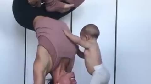 Baby Climbs On Mom Performing Yoga Pose 🥰