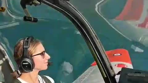 Beautiful woman experiences airplane pilot,