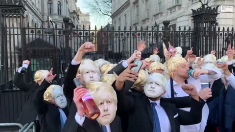 EPIC-Crowd dressed like Boris Johnson party outside "We are Boris, this is a work event."