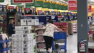 Outrageous mom drags kid behind shopping cart at walmart!!
