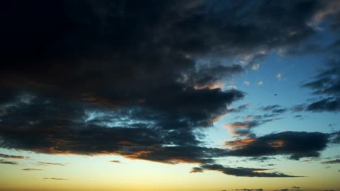 Dark clouds at sunset, landscape