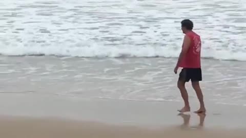 Kid with boogie board gets hit by wave "into the water"